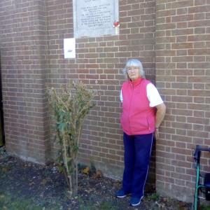 Jean Povey by the memorial plaque